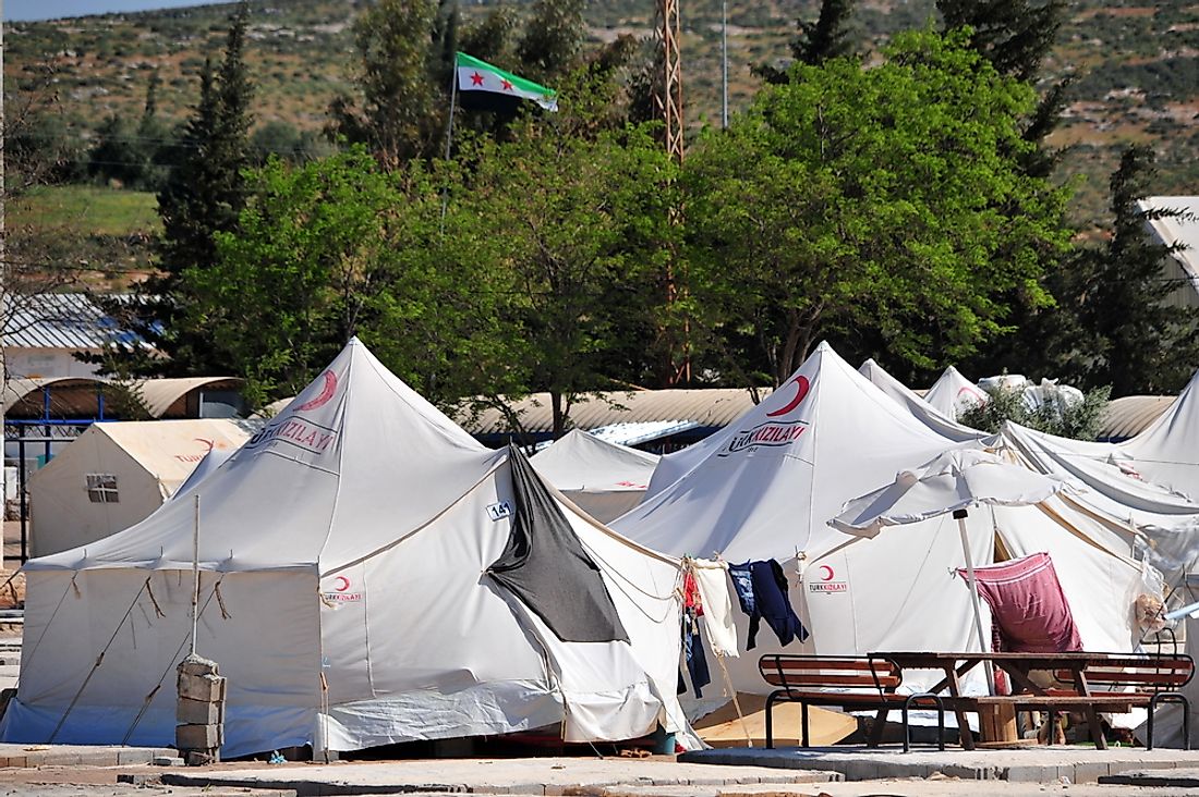 A refugee camp at the border between Turkey and Syria. Photo credit: thomas koch / Shutterstock.com.