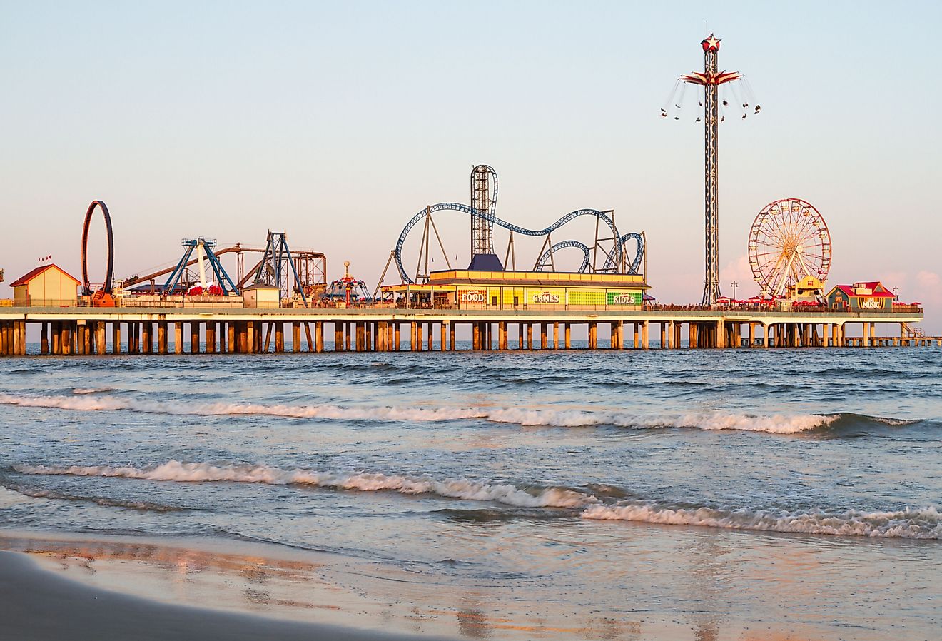 Galveston Island and beach with theme park on the pier. Image credit Carlos Bruzos Valin via Shutterstock.