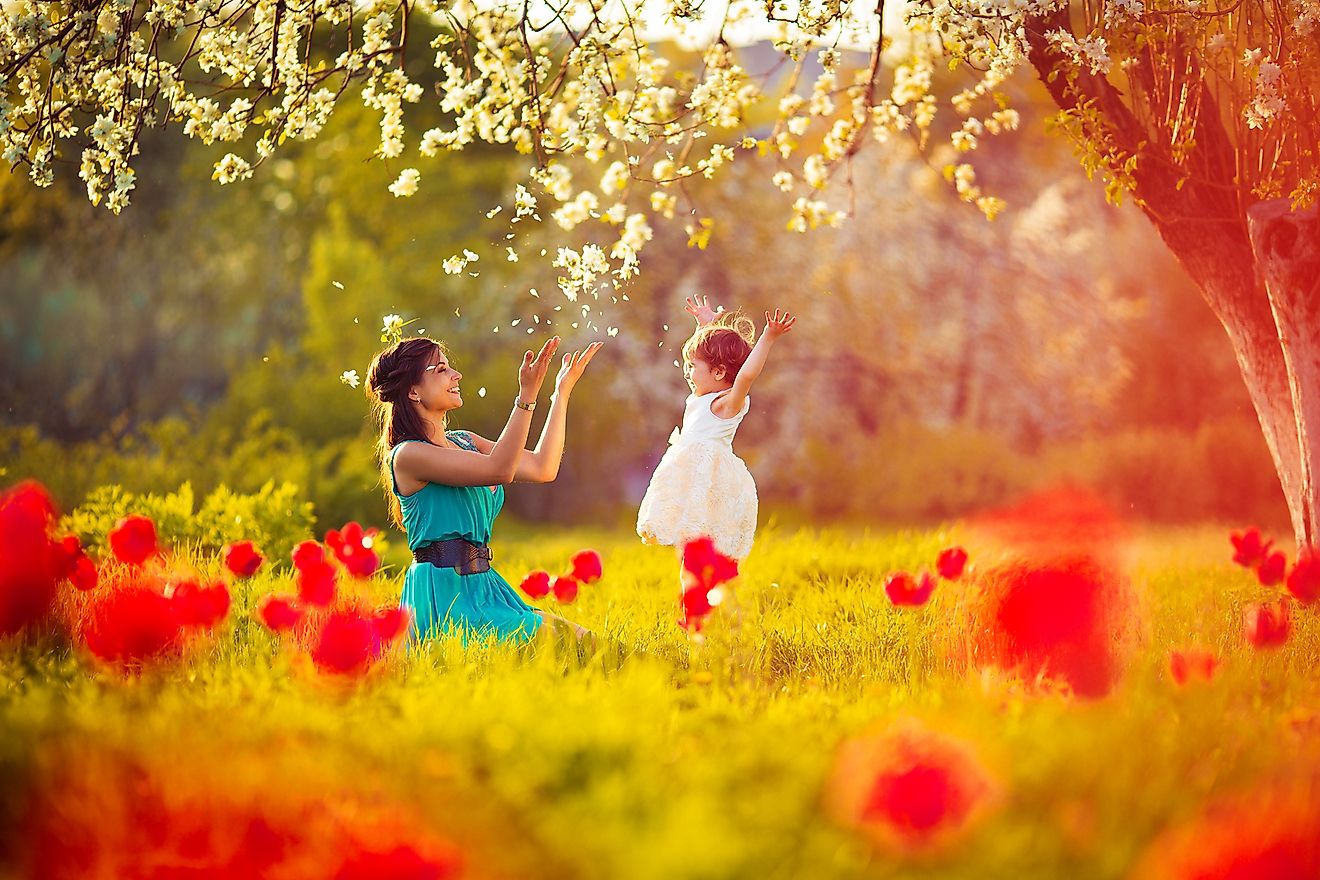 A mother and child celebrating the colors and blossoms of spring.