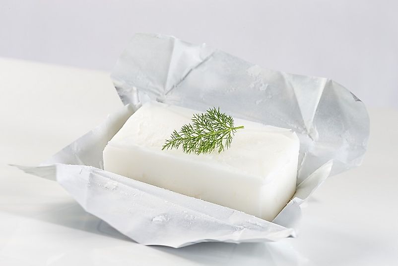 A block of lard derived from pork fat and rendered, formed, and packaged for commercial retail and culinary use.