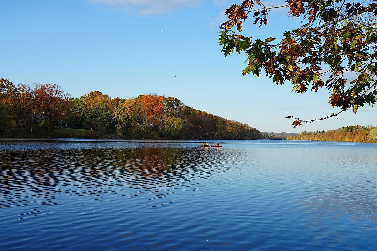 View of people kayaking in the fall on Lake Carnegie in Princeton, New Jersey. Editorial credit: EQRoy / Shutterstock.com