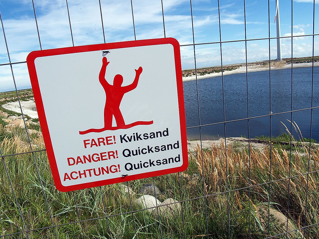 Warning sign for quicksand in Frederikshavn in Denmark. Image credit: Matthew Bargo/Wikimedia.org