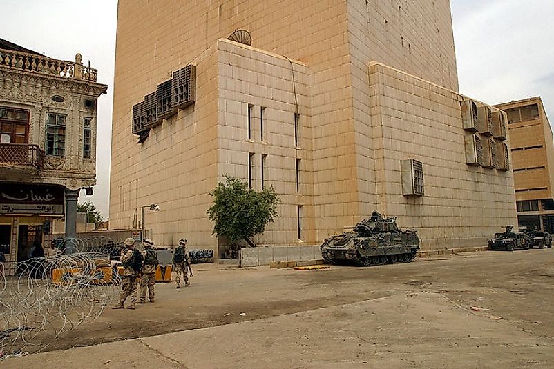 U.S. Soldiers guarding the Central Bank of Iraq shortly after it experienced the most valuable bank heist in world history.