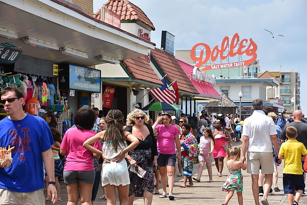 People on the beach boardwalk in Delaware. Editorial credit: Ritu Manoj Jethani / Shutterstock.com. 