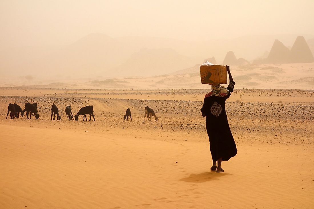 A woman walks during a sandstorm in Sudan. 