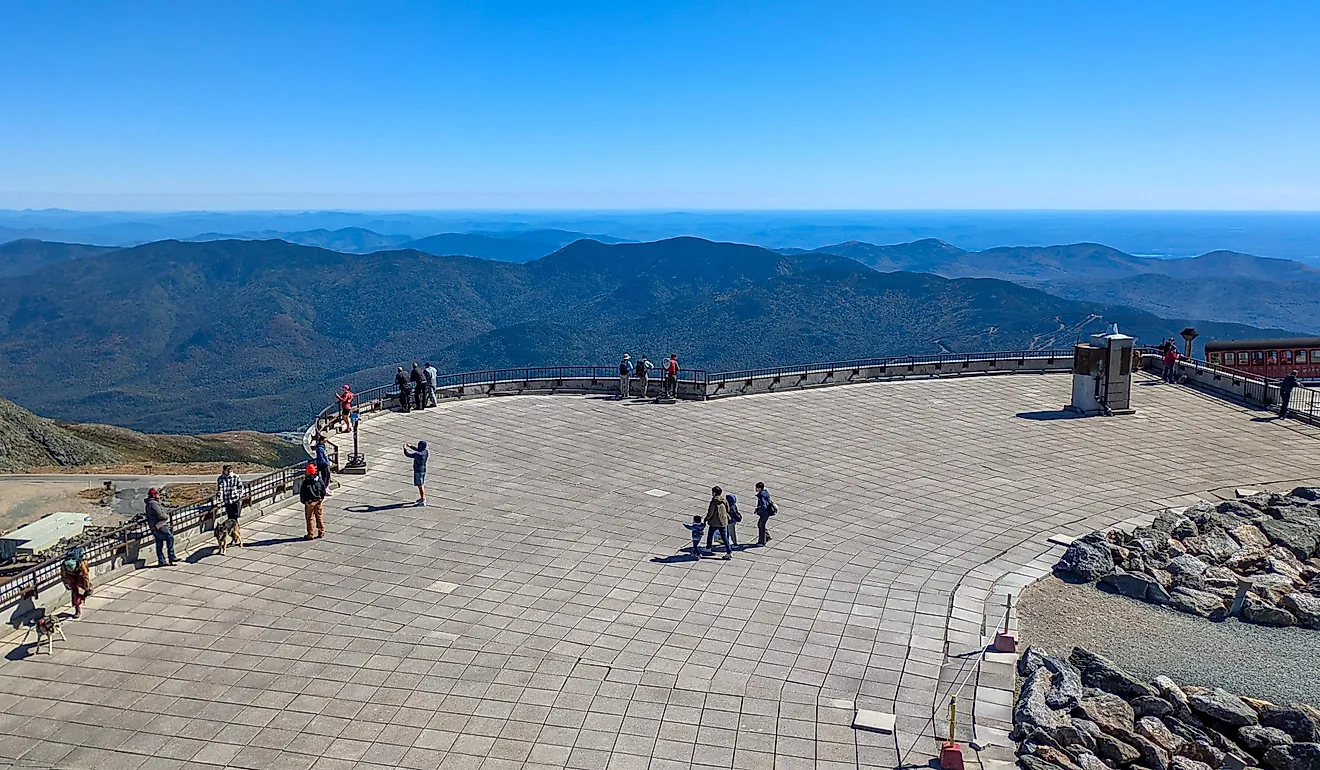  Tourists standing on the observation deck at the summit of Mount Washington. Editorial credit: travelview / Shutterstock.com