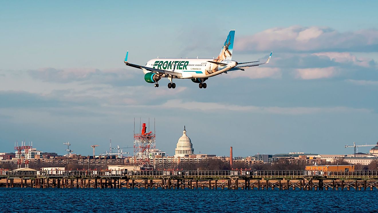 A Frontier Airlines Airbus A320 landing at the Ronald Reagan Washington National Airport. Editorial credit: Andrew Mauro / Shutterstock.com