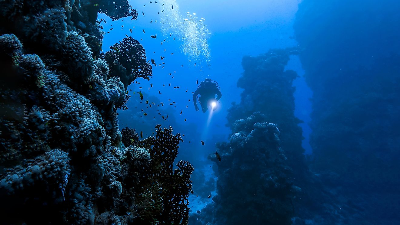 Underwater diver in deep sea dive. 