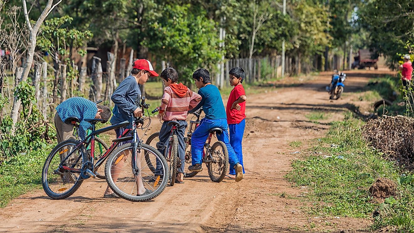 A group of Paraguayan boys cycling together. Image credit: Jan Schneckenhaus/Shutterstock.com