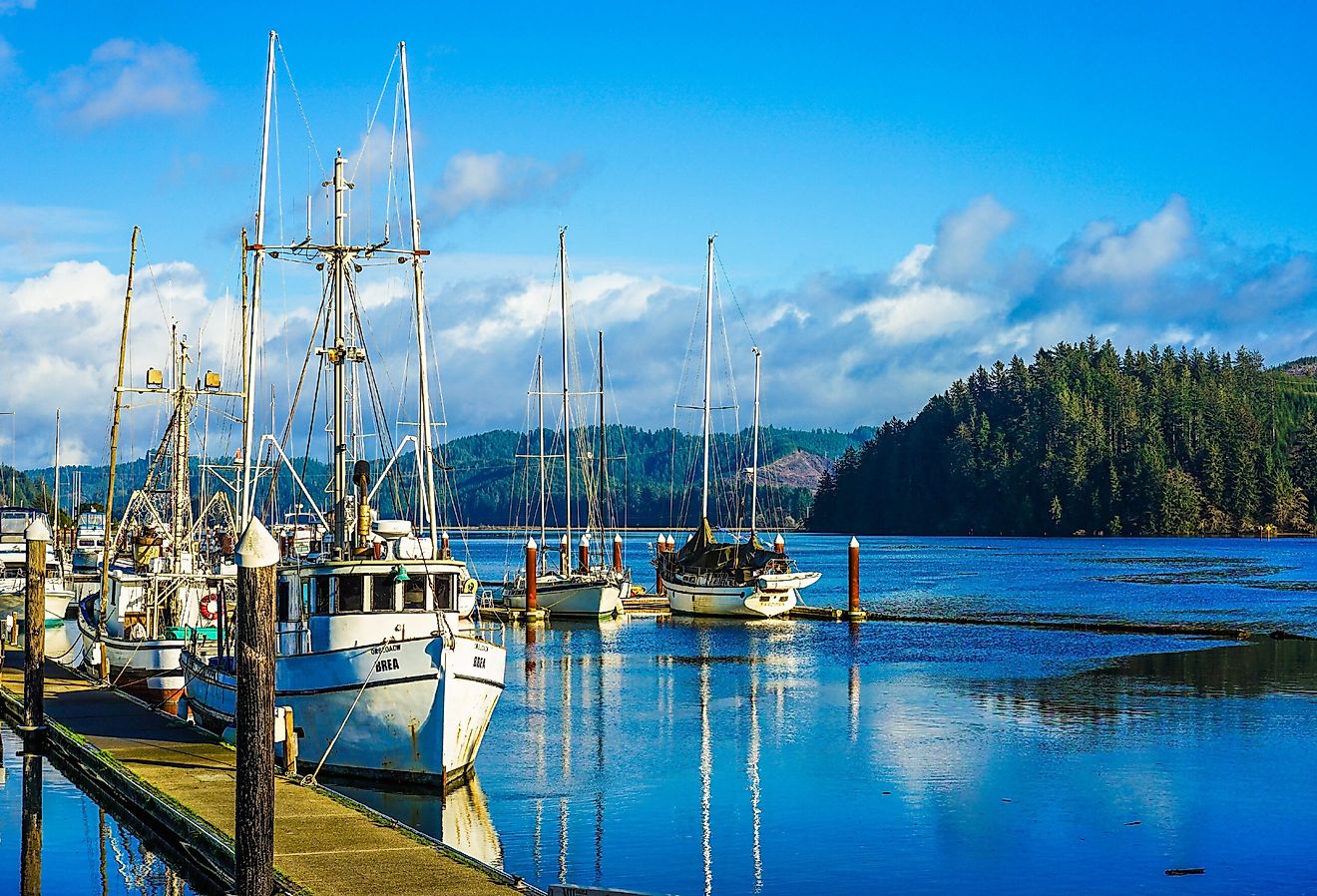 Old small fishing boat in harbor in Florence, Oregon. Image credit NeungPH via Shutterstock