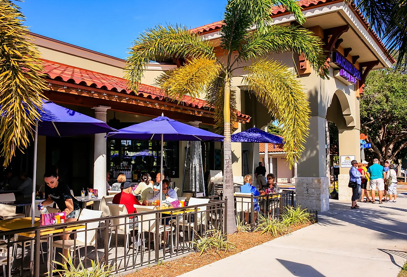 People enjoying an alfresco meal outside a restaurant in downtown Venice, Florida