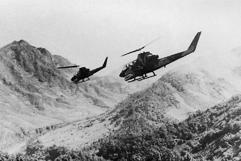 U.S. Army AH-1 Cobra helicopters preparing to attack North Vietnamese forces in Laos.