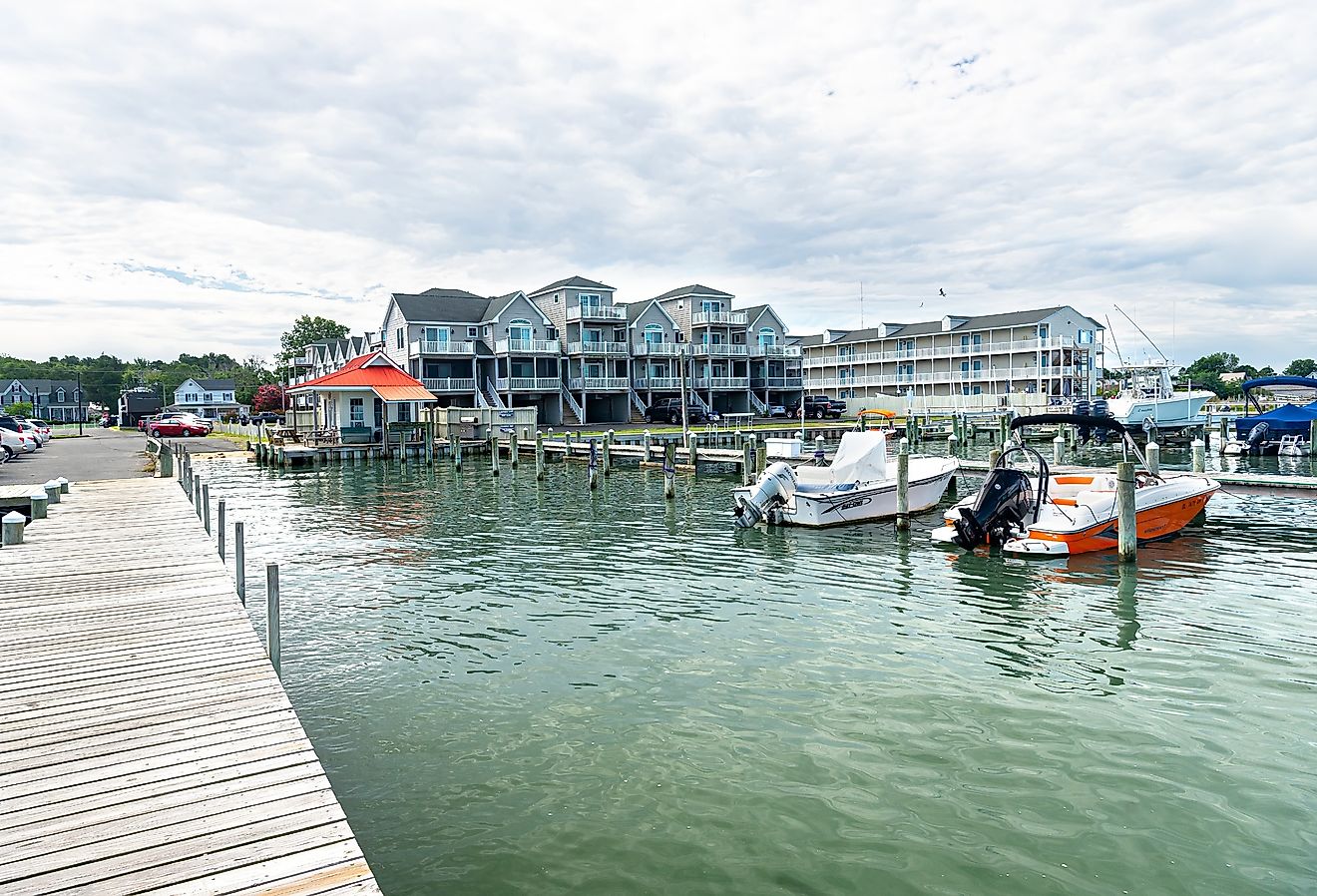 Wooden pier and waterfront in Chincoteague, Virginia. Image credit Kosoff via Shutterstock