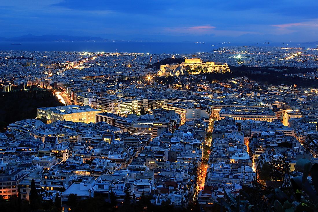 View of Athens skyline, with buildings giving unobstructed view of the Parthenon.