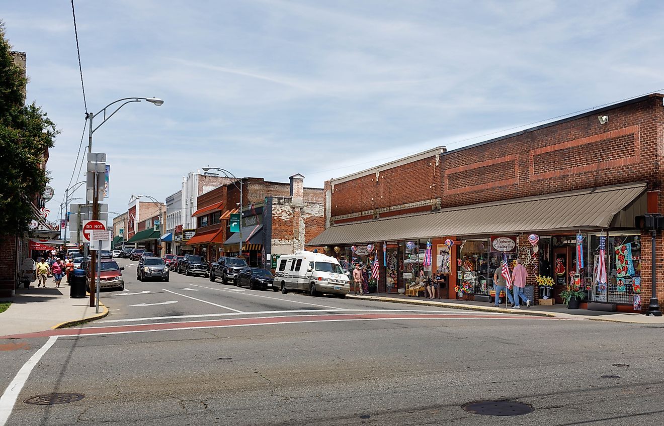 A wide-angle view down Main Street, showing colorful shops and numerous people walking, Mount Airy, North Carolina, via J. Michael Jones / Shutterstock.com