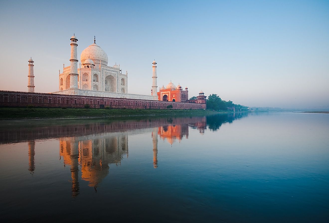 Sunrise at Taj Mahal in India on Jamuna River. Image credit Pius Lee via Adobe Stock.