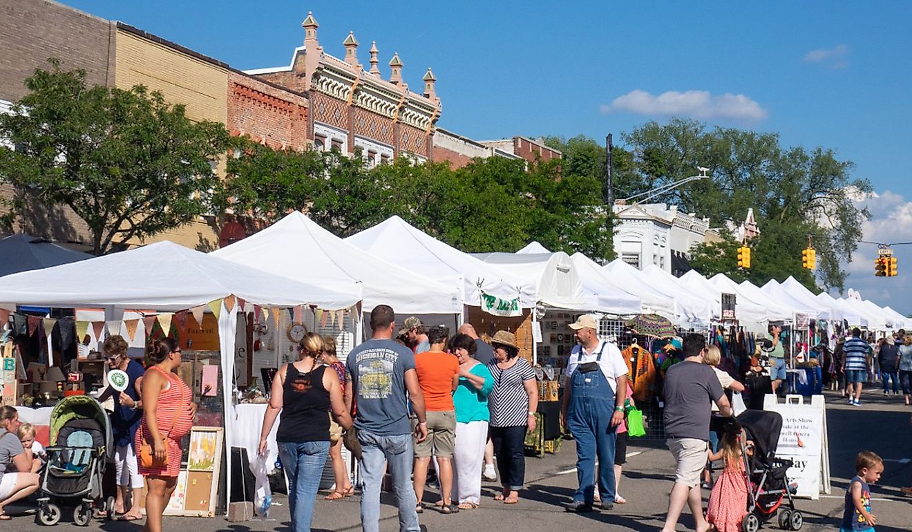 Crowds on a sunny day enjoying an art fair on Main Street in Howell, via NCSchneider_Images / Shutterstock.com