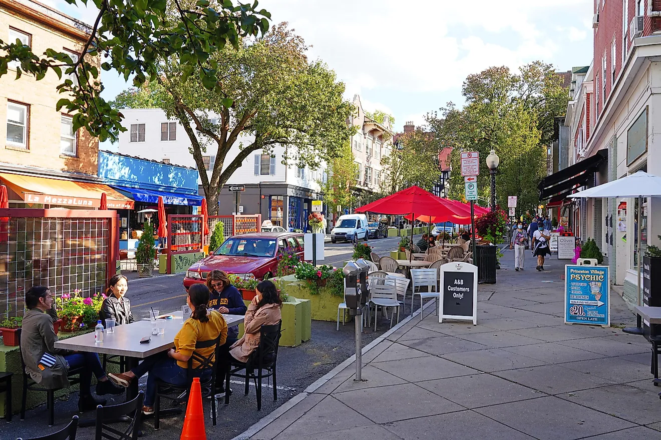 View of people eating on outdoor patios on Witherspoon Street in downtown Princeton, New Jersey.