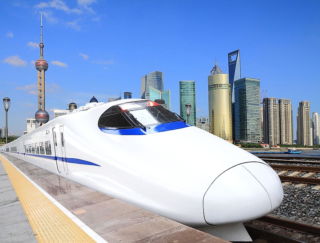 A high speed train with Shanghai in the background. 