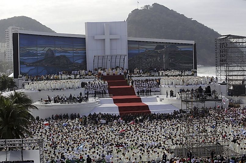 Rio de Janeiro, Brazil's Catholic denizens crowd Copacabana Beach as Pope Francis leads them in Mass.
