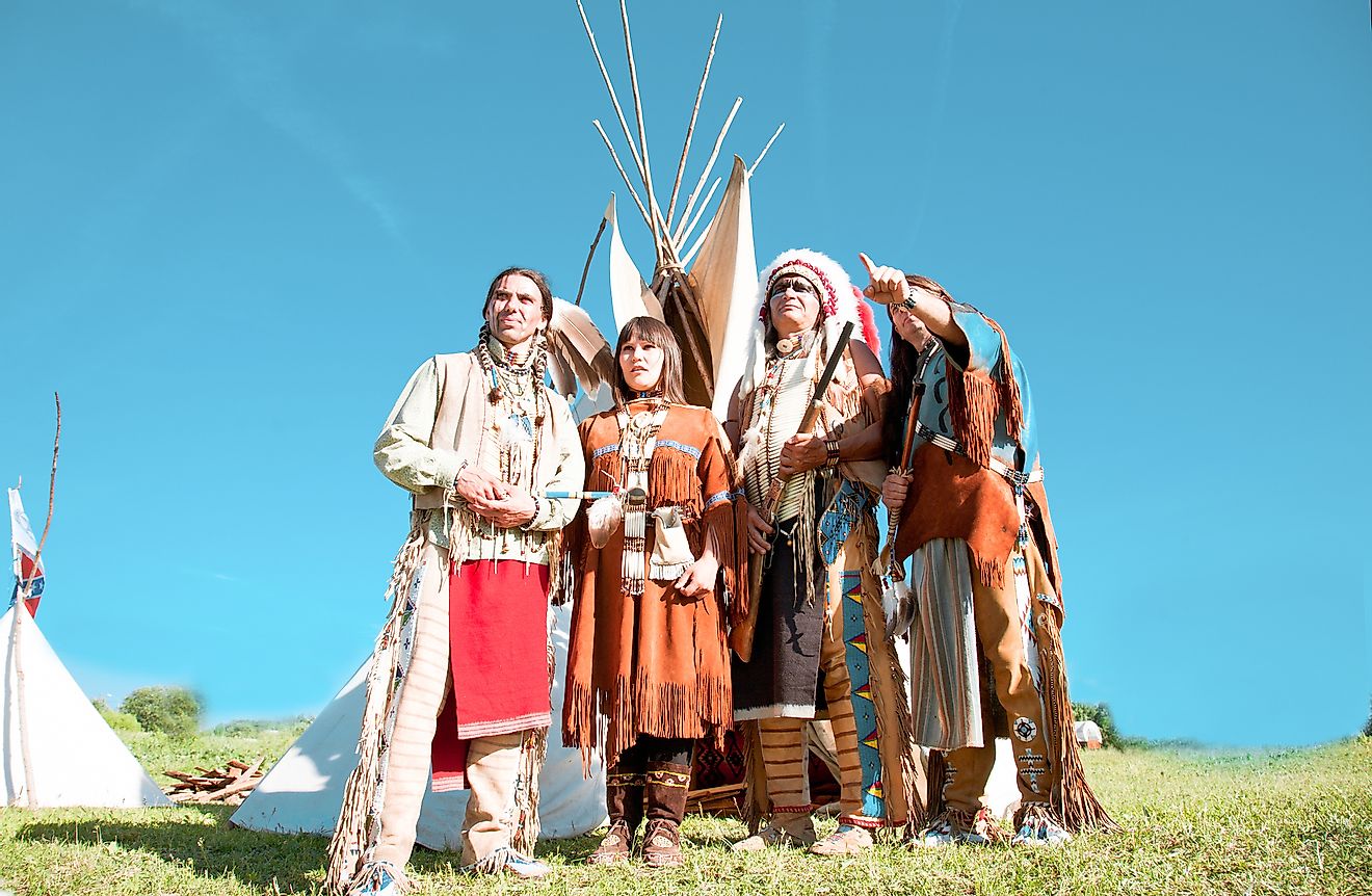 Group of North American Indians about a wigwam. Image credit: Shchipkova Elena/Shutterstock.com