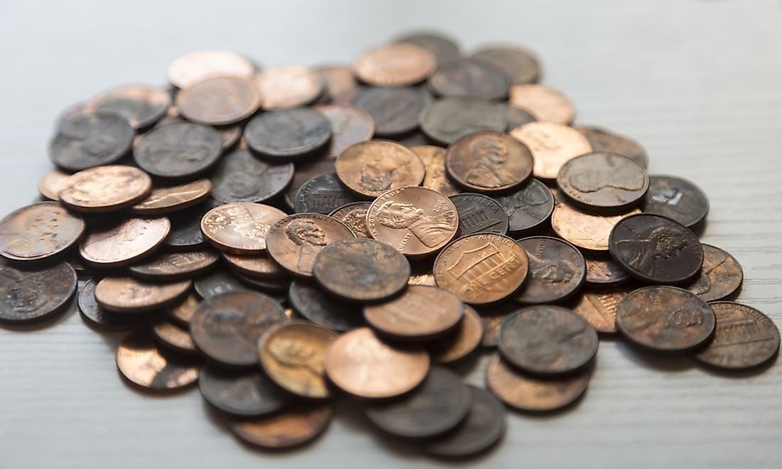 A pile of new and old pennies. 