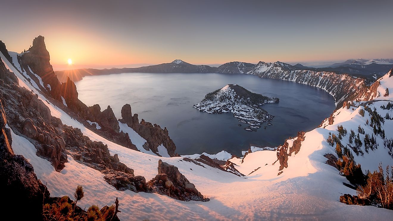 Sunrise at Crater Lake National Park, Oregon. The lake was formed due to volcanic activity. Image credit: Theerapat Chawannakul/Shutterstock.com