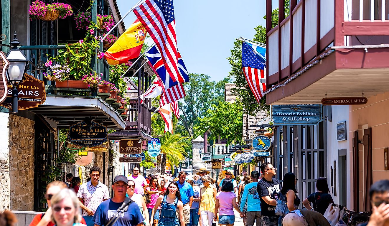 People shopping at Florida city St George Street by stores shops and restaurants in St. Augustine. 