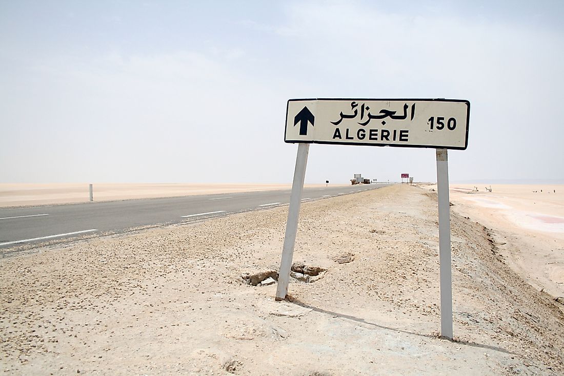 A sign advertising the upcoming border crossing into Algeria.