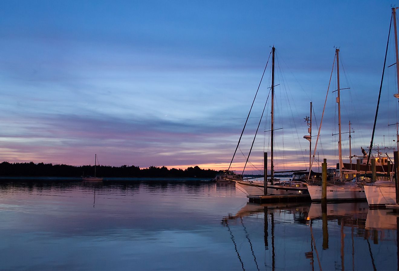Sailboats sit quietly in calm waters in historic Beaufort, NC. 