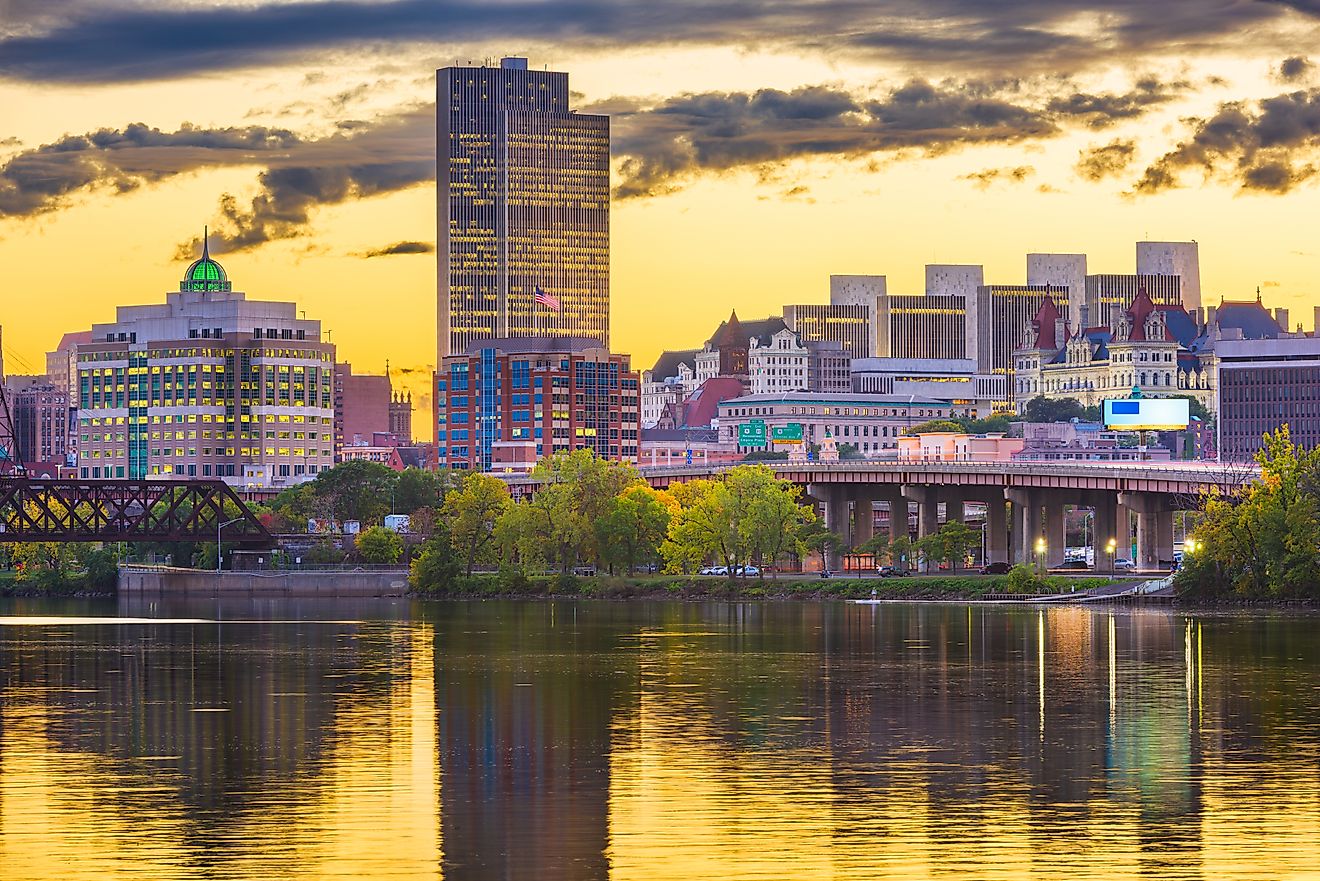 Albany, New York, skyline on the Hudson River at sunset.