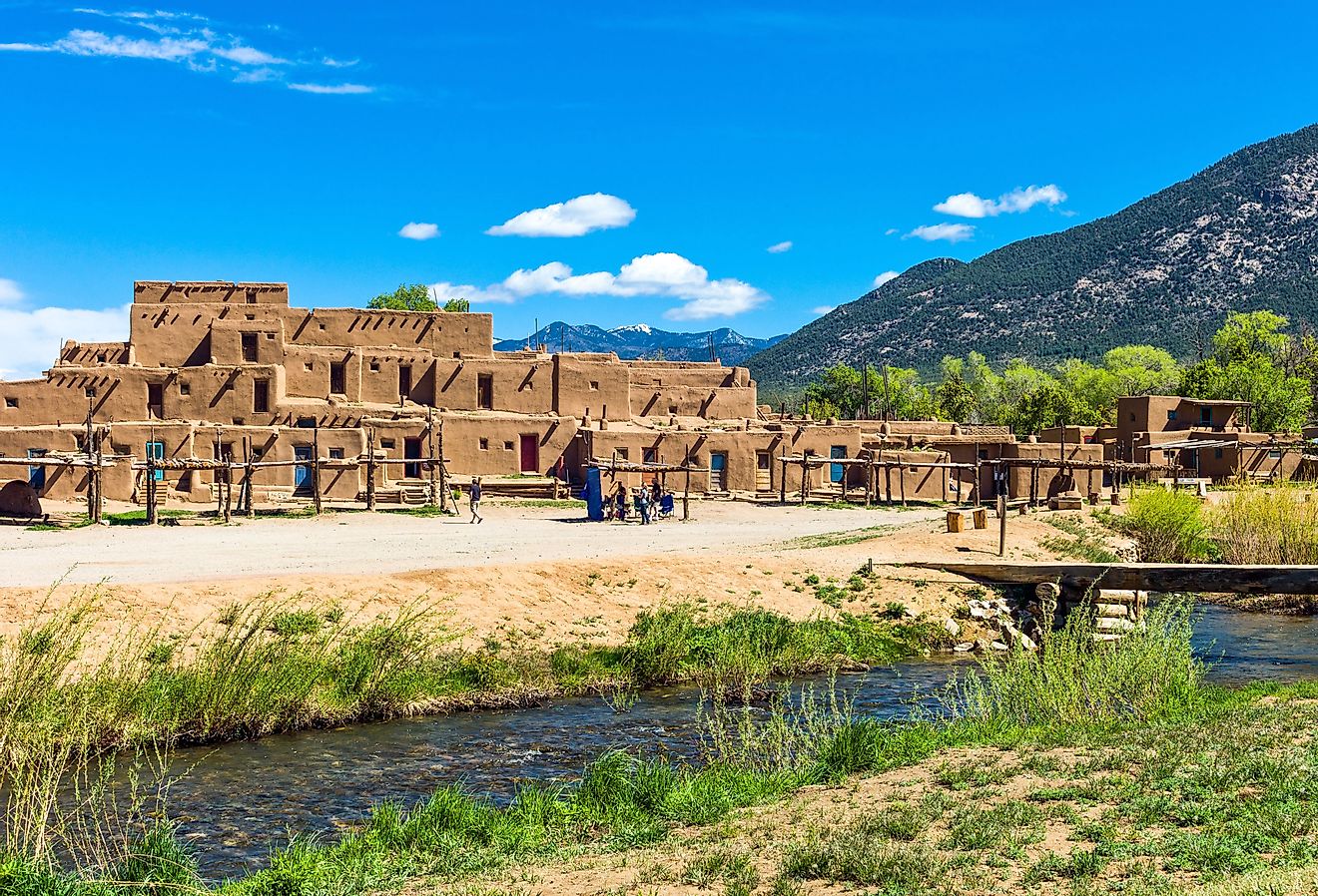 Taos Pueblo with mountains in the background. Image credit Gimas via Shutterstock. 