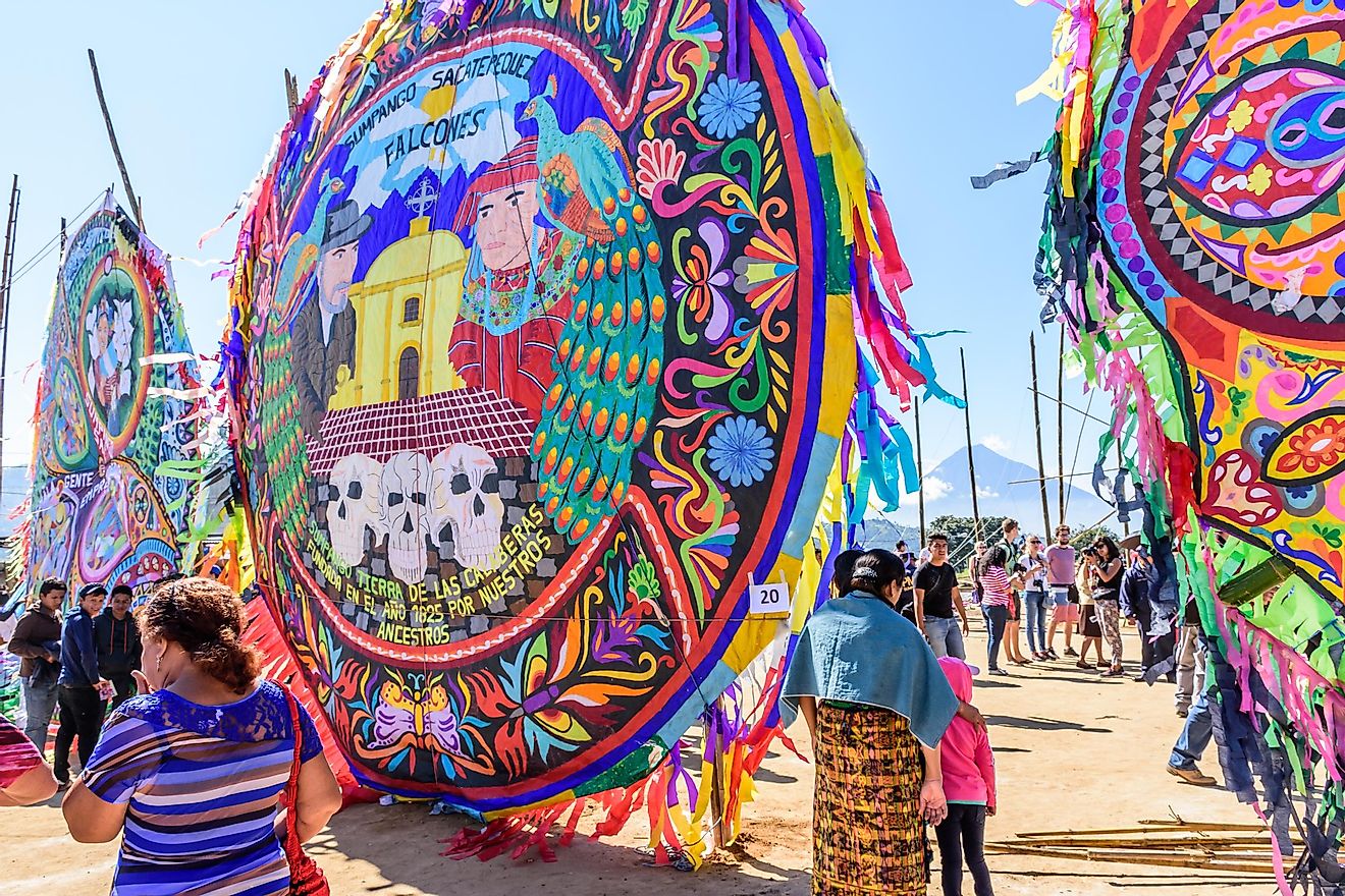 Visitors at giant kite festival on All Saints' Day honoring spirits of dead in Sumpango, Guatemala. Editorial credit: Lucy Brown - loca4motion / Shutterstock.com