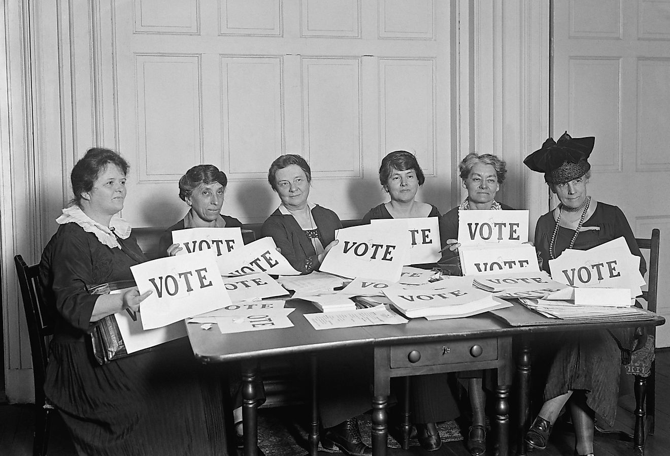 National League of Women Voters hold up signs reading, "VOTE." Image credit Everett Collection via Shutterstock
