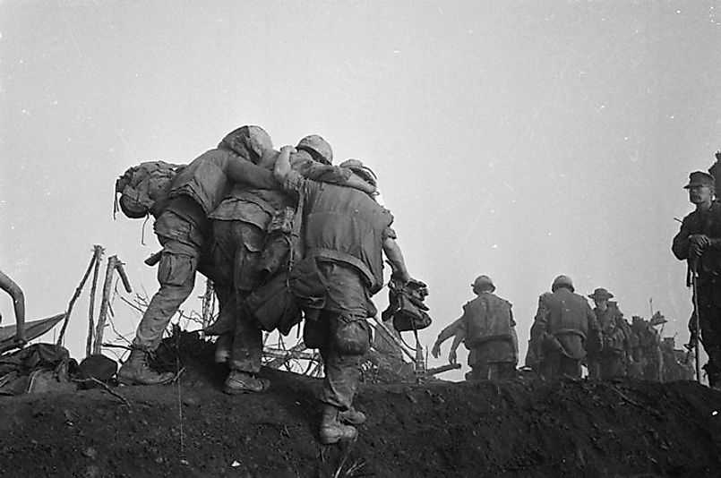 U.S. Marines carry a wounded comrade off of the battlefield during Operation Dewey Canyon.