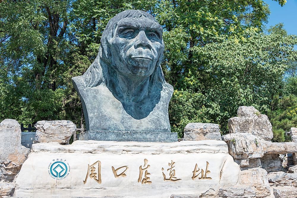 Peking Man statue at the Zhoukoudian cave system site in Beijing, China. Editorial credit: beibaoke / Shutterstock.com