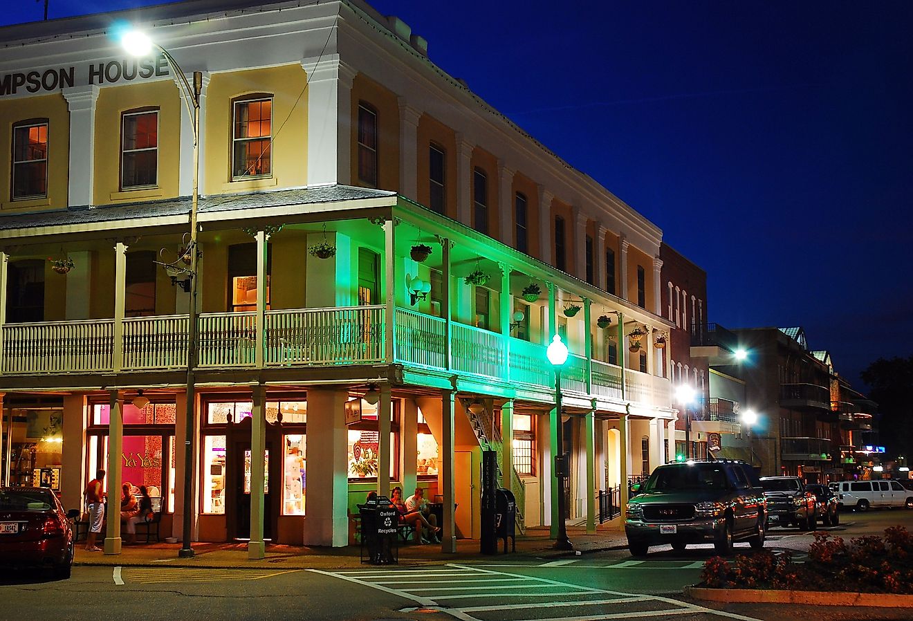 The lights of the stores in downtown Oxford, Mississippi begin to glow at twilight. Image credit James Kirkikis / Shutterstock.com
