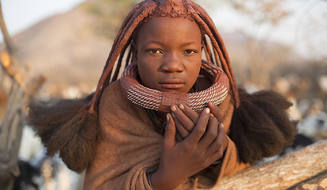 A young Himba girl in Epupa, Namibia.  Editorial credit: 2630ben / Shutterstock.com