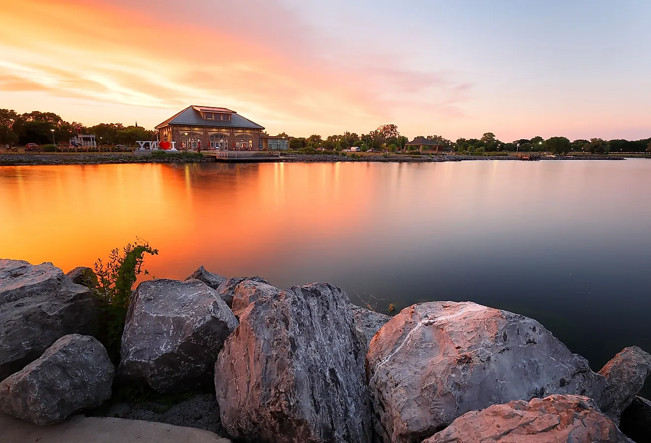  Beautiful sunset of Seneca Lake and Finger Lakes Welcome Center in Geneva, NY. Image credit Jay Yuan via Shutterstock.