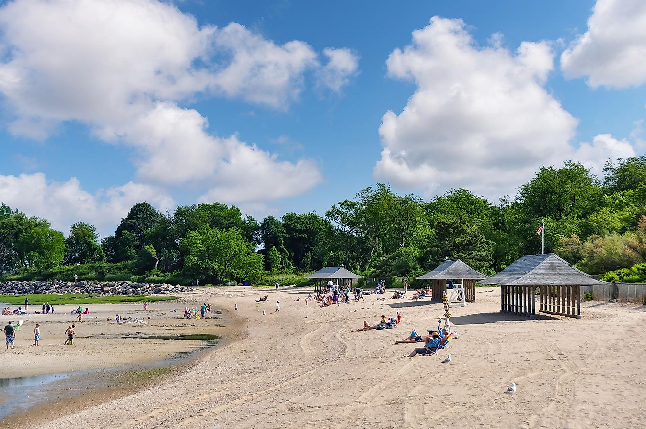 Panoramic view over the beach of Greenwich Point Park or Tods Point with number of people enjoying the beach and sun