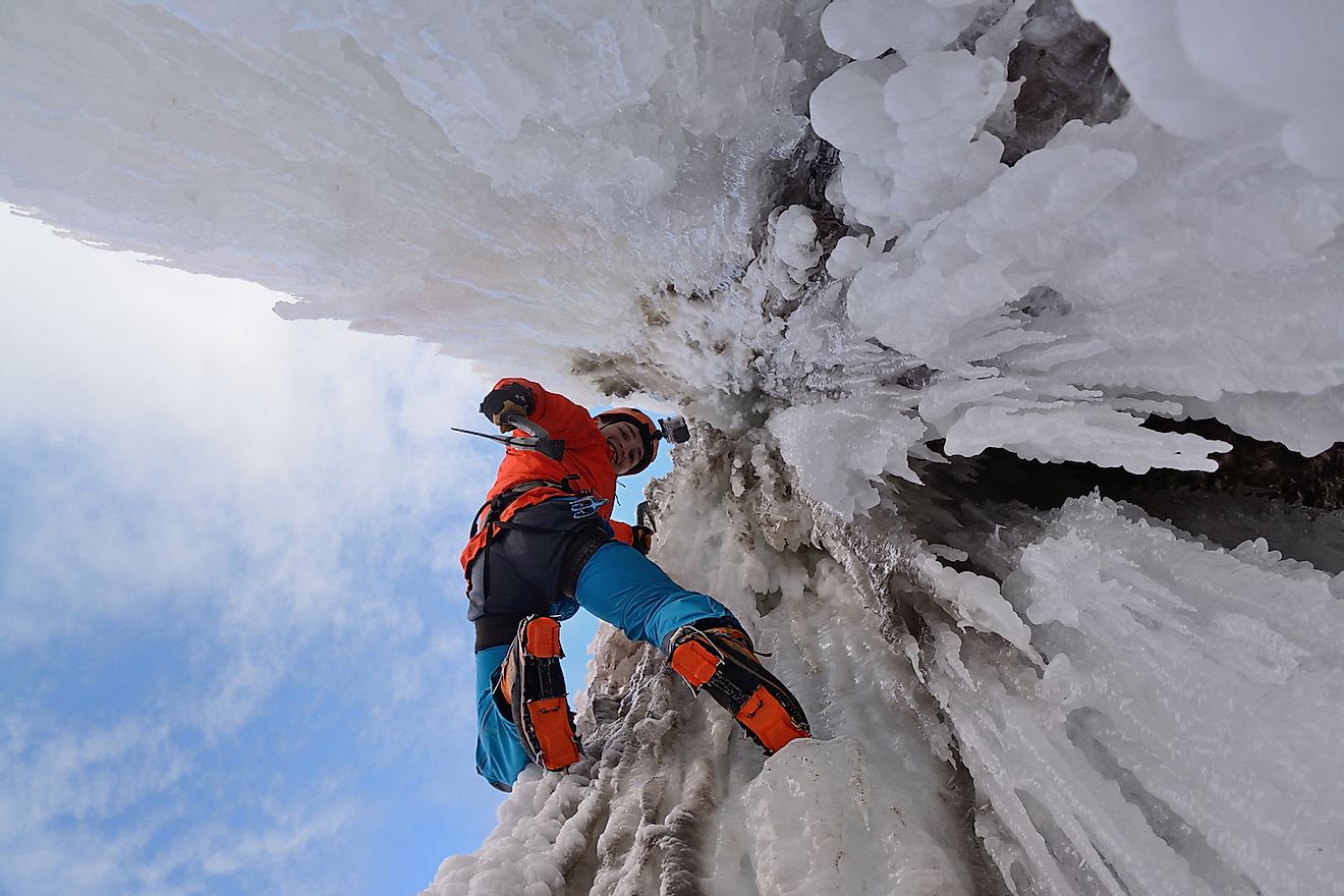 An ice climber on a waterfall. Image credit: Artem Novichenko/Shutterstock.com