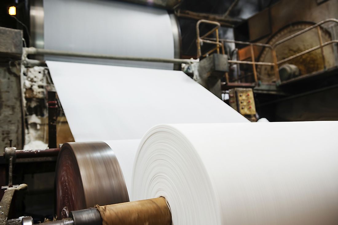 Industrial paper-making machinery at a pulp and paper plant production plant. 