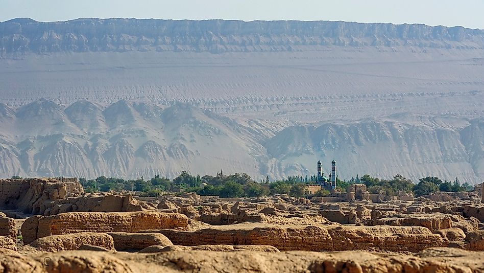 A mosque surrounded by rugged terrain in the Gaochang District of the Xinjiang Autonomous Region of China.