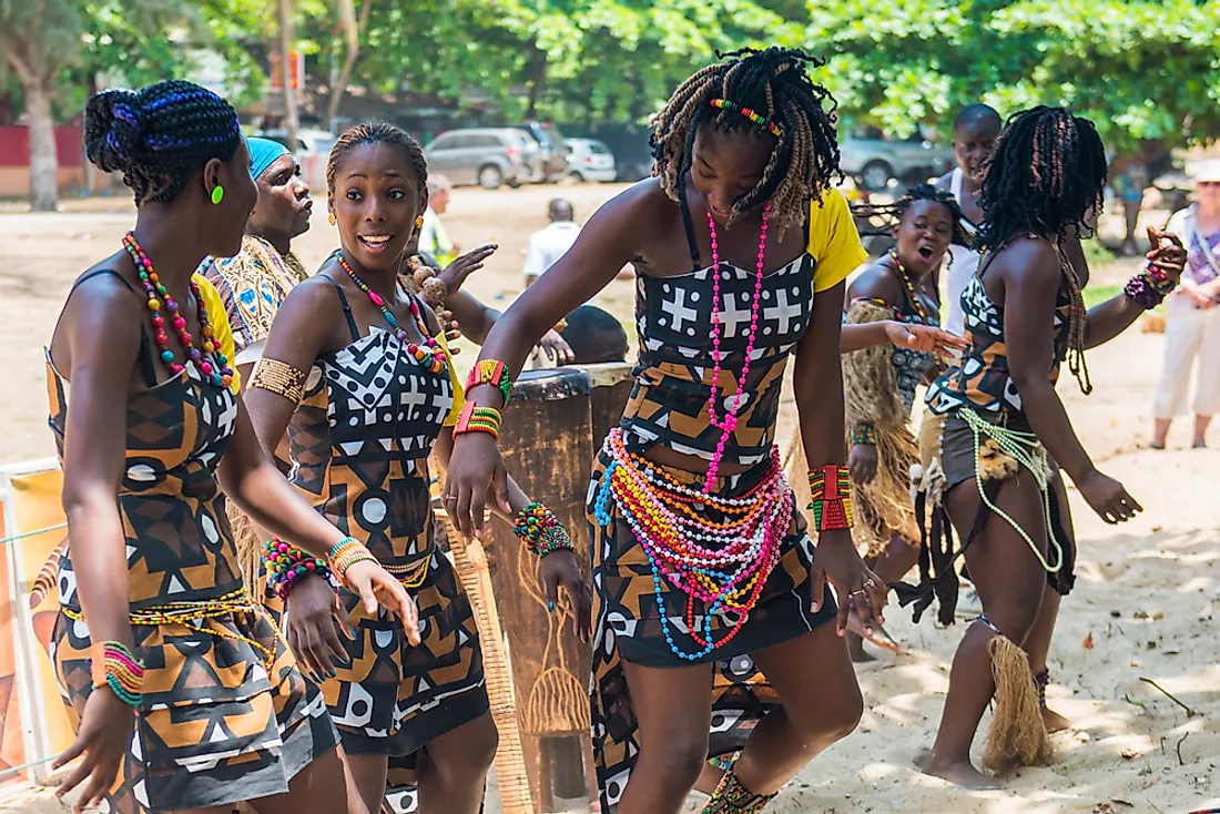 Angolan men perform in a street concert in Angola. Editorial credit: Anton_Ivanov / Shutterstock.com. 