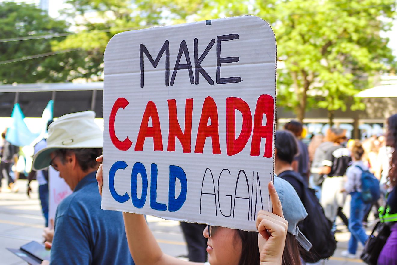 Protester at the Global Climate Justice Strike, part of the Fridays for Future movement, carries sign saying Make Canada Cold Again during march downtown. Image credit: Expatpostcards/Shutterstock.com