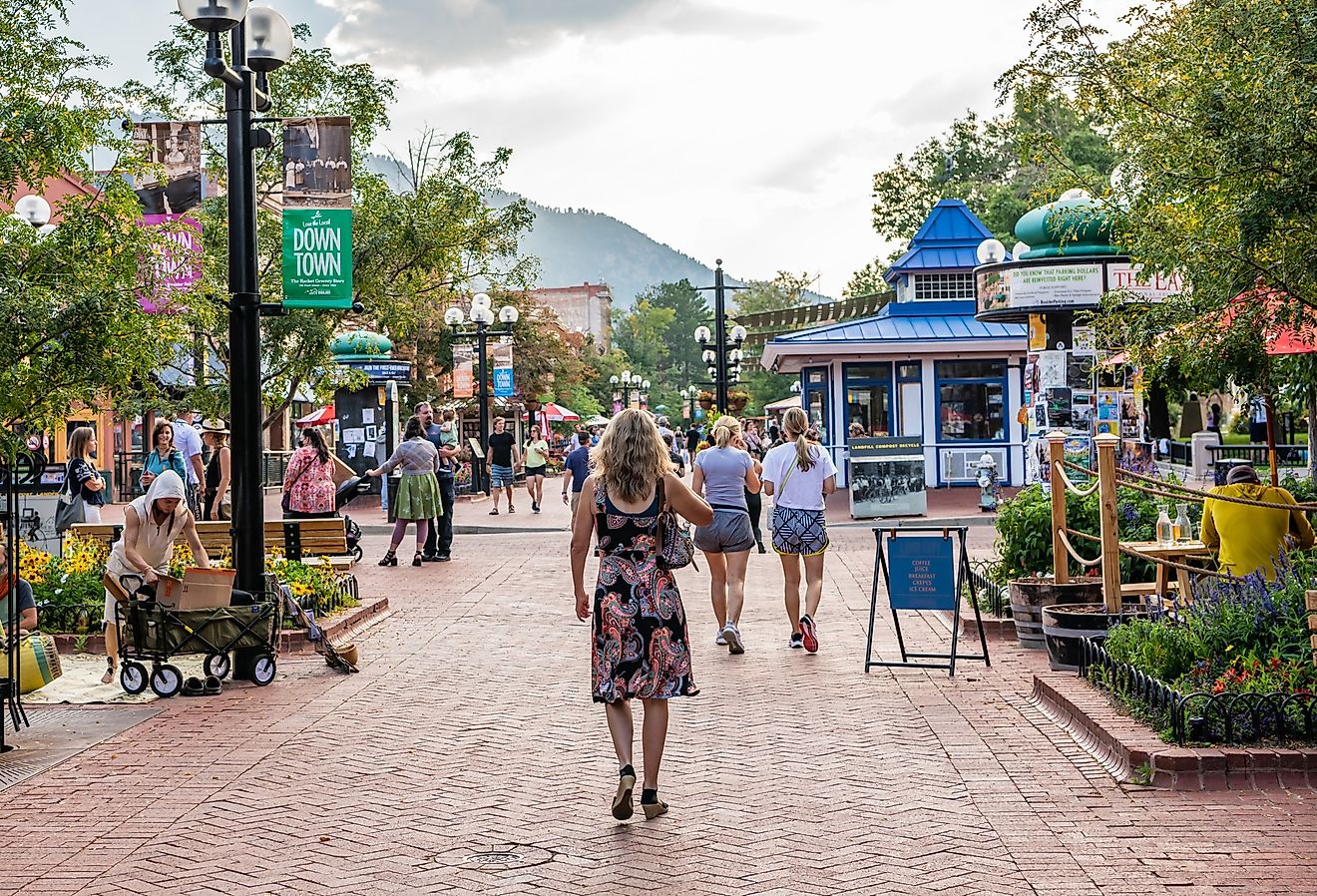 People explore the famous Pearl Street Mall, downtown, on a beautiful evening in Boulder, Colorado. Image credit Page Light Studios via Shutterstock