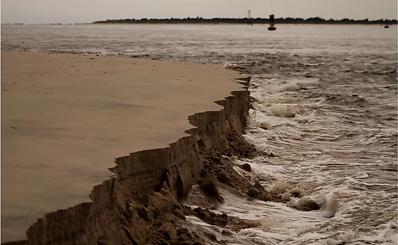 Erosion at action along the sea beach by action of waves.