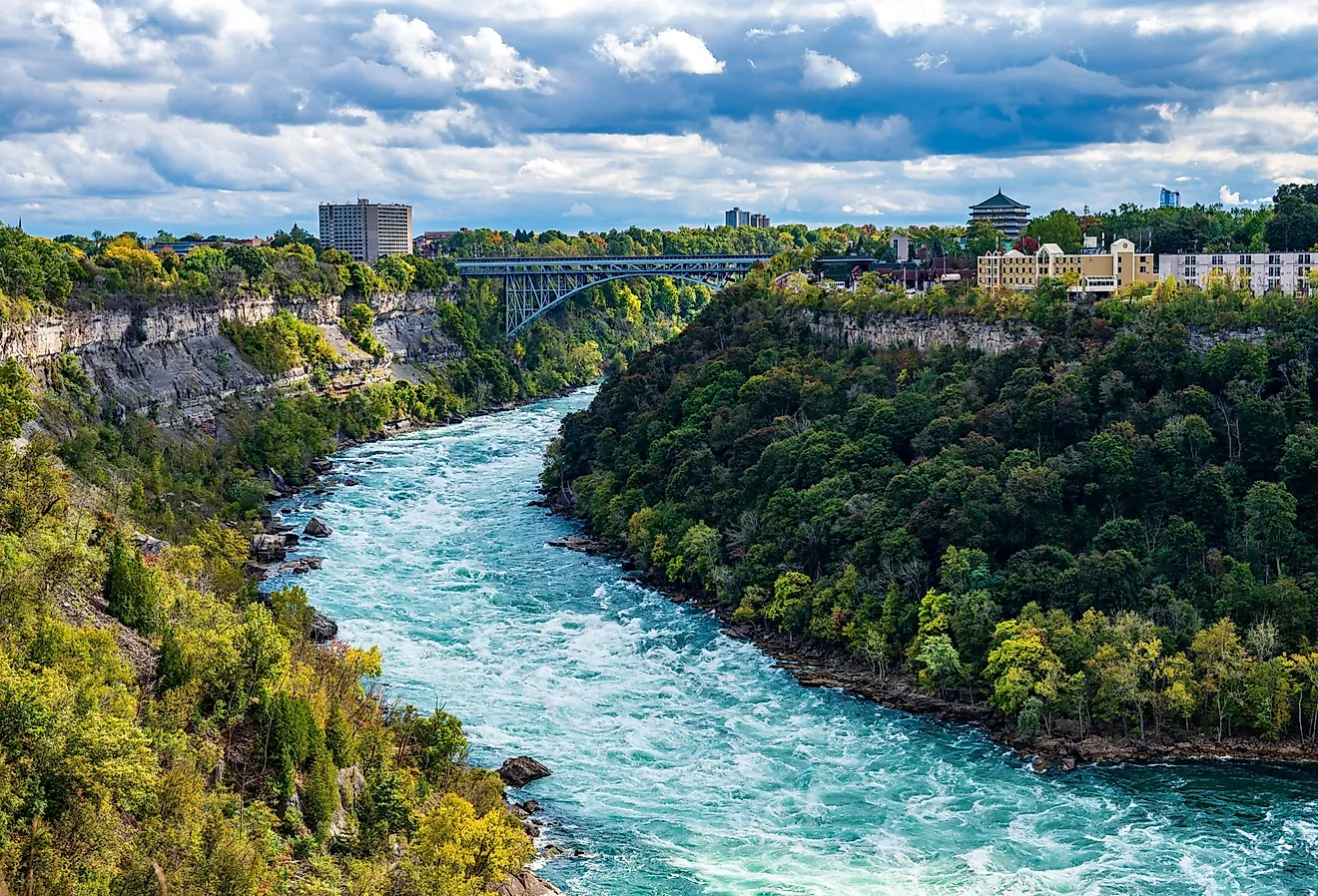 Whirlpool Rapids Bridge crosses Niagara River between Niagara Falls in New York and Niagara Falls in Ontario. Image credit: Randy Runtsch via Shutterstock.