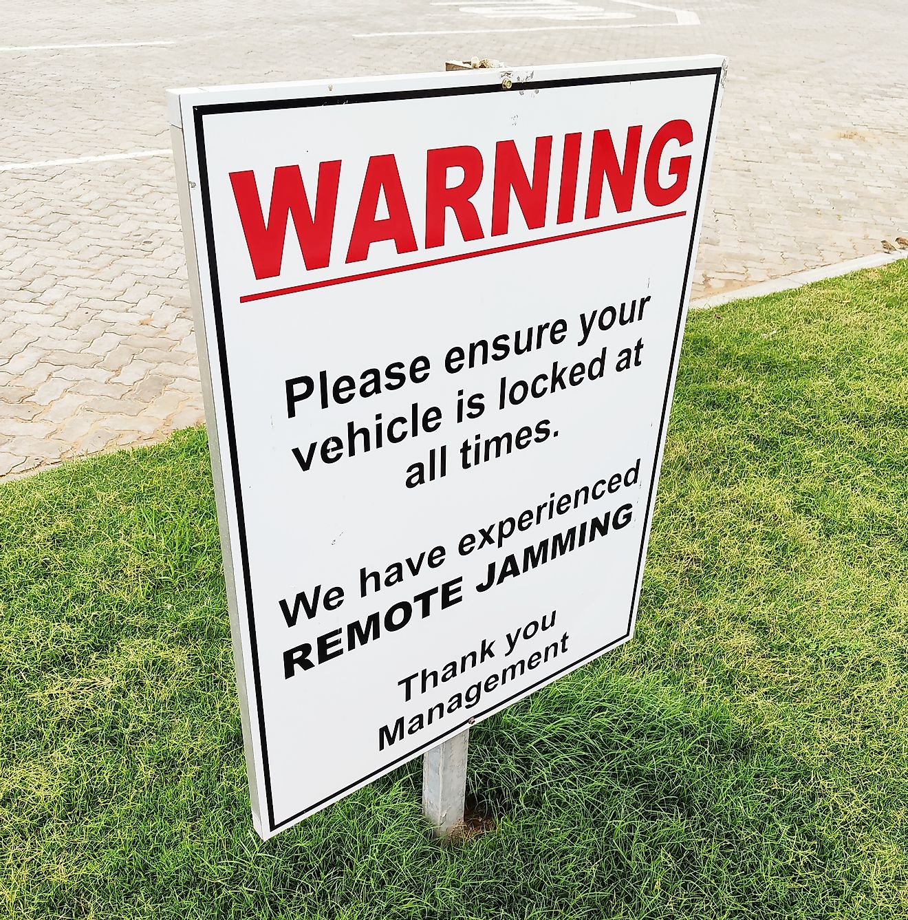Radio jamming car theft warning sign in South Africa. Image credit: MD_Photography/Shutterstock.com
