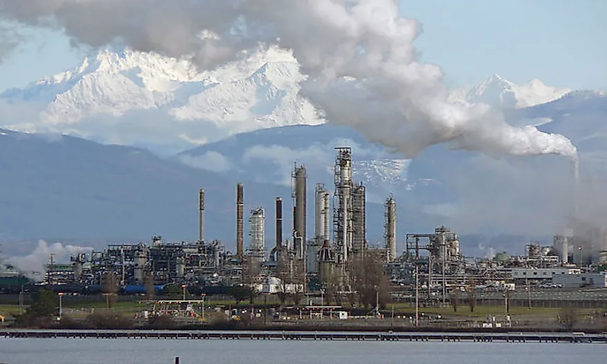 A petroleum refinery spewing out toxic fumes into the air.